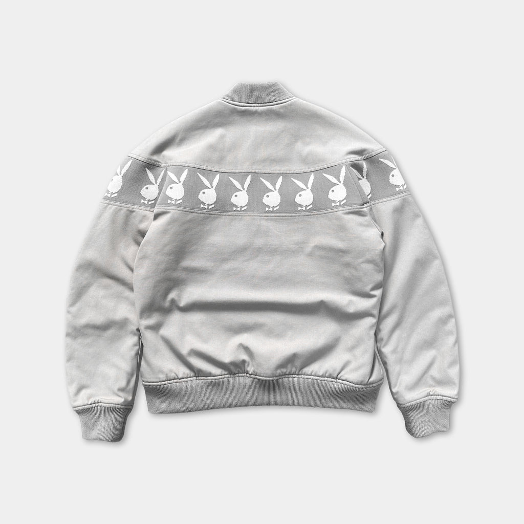 A gray jacket with a repeating pattern of white bunny images on the back.