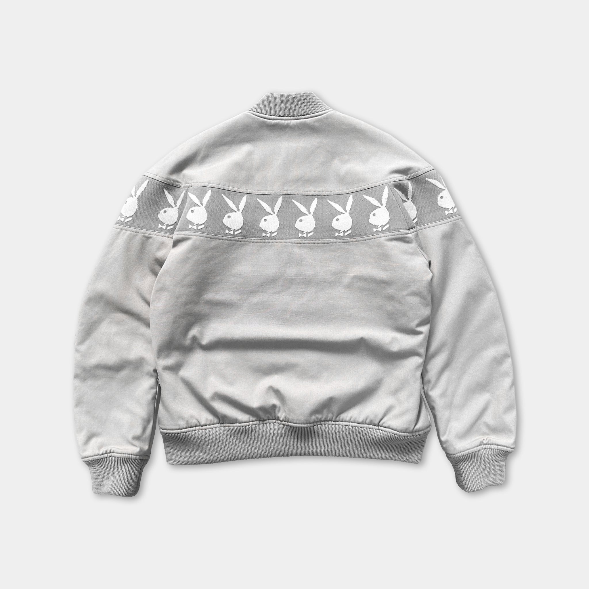 A gray jacket with a repeating pattern of white bunny images on the back.