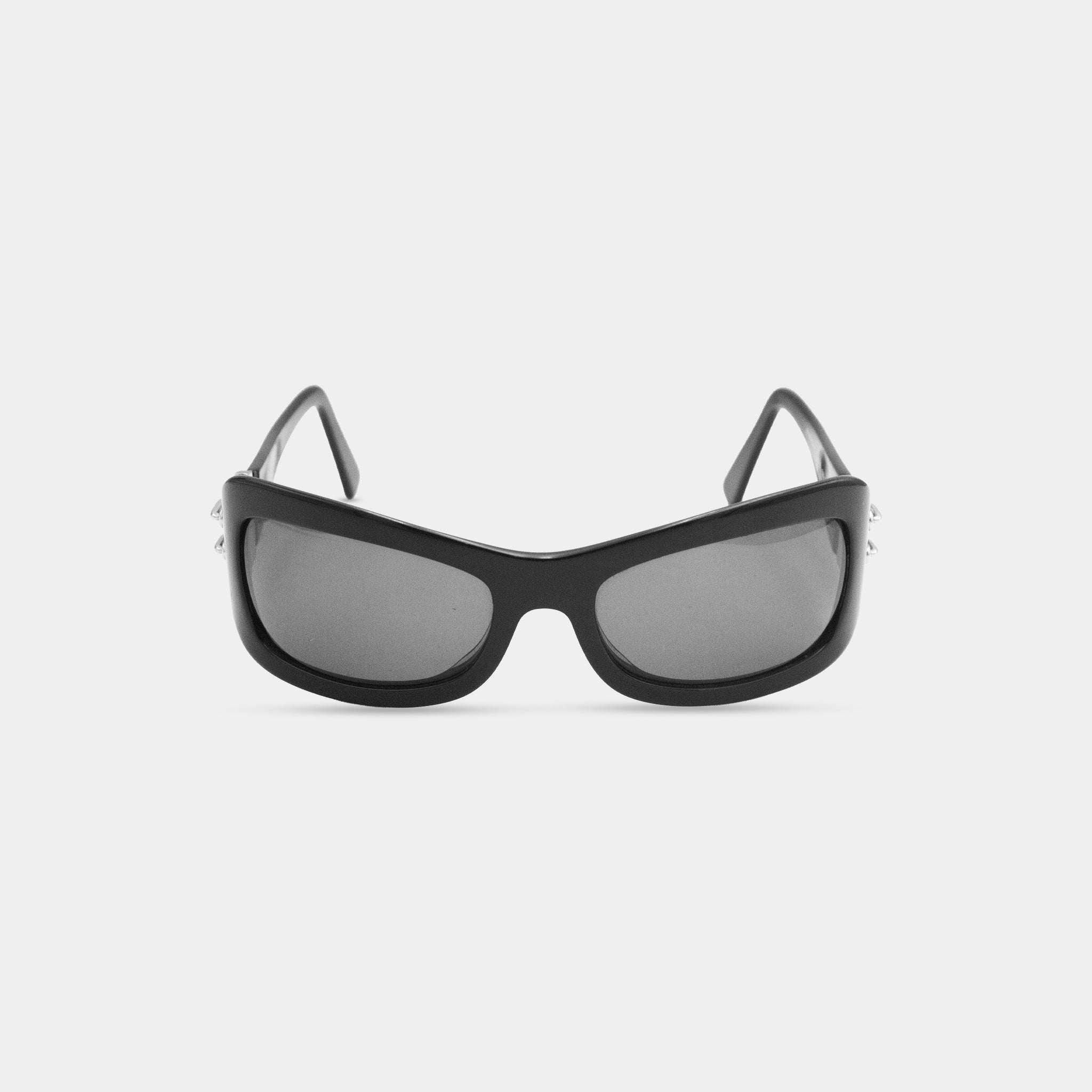 A pair of black sunglasses with dark lenses.