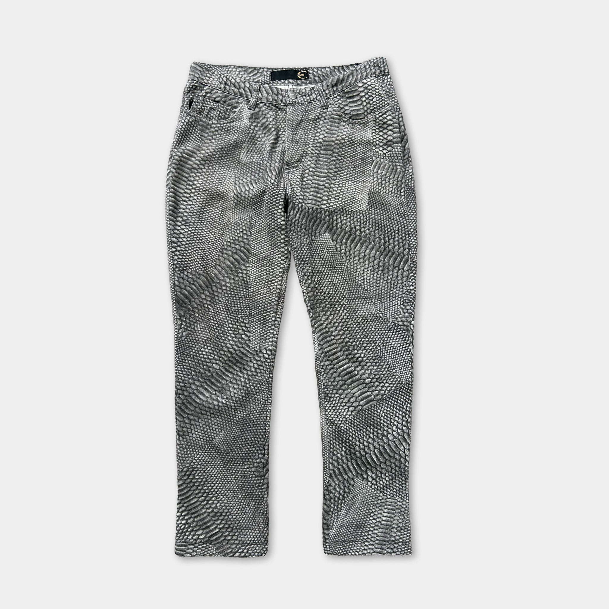 A pair of black and white patterned jeans with a distinctive snake skin-like design.