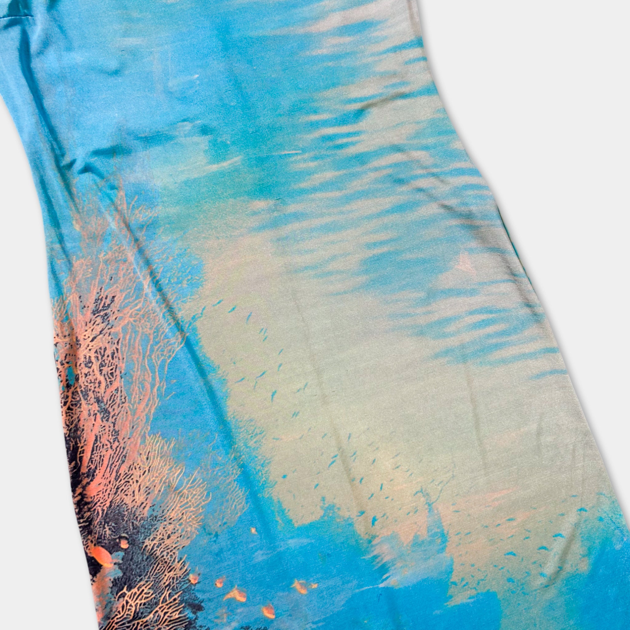 a vibrant, abstract pattern of blue and orange hues, resembling a painting or artwork.