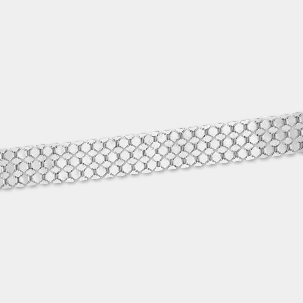 A silver-colored metal bracelet with a repeating pattern of small hexagonal shapes.