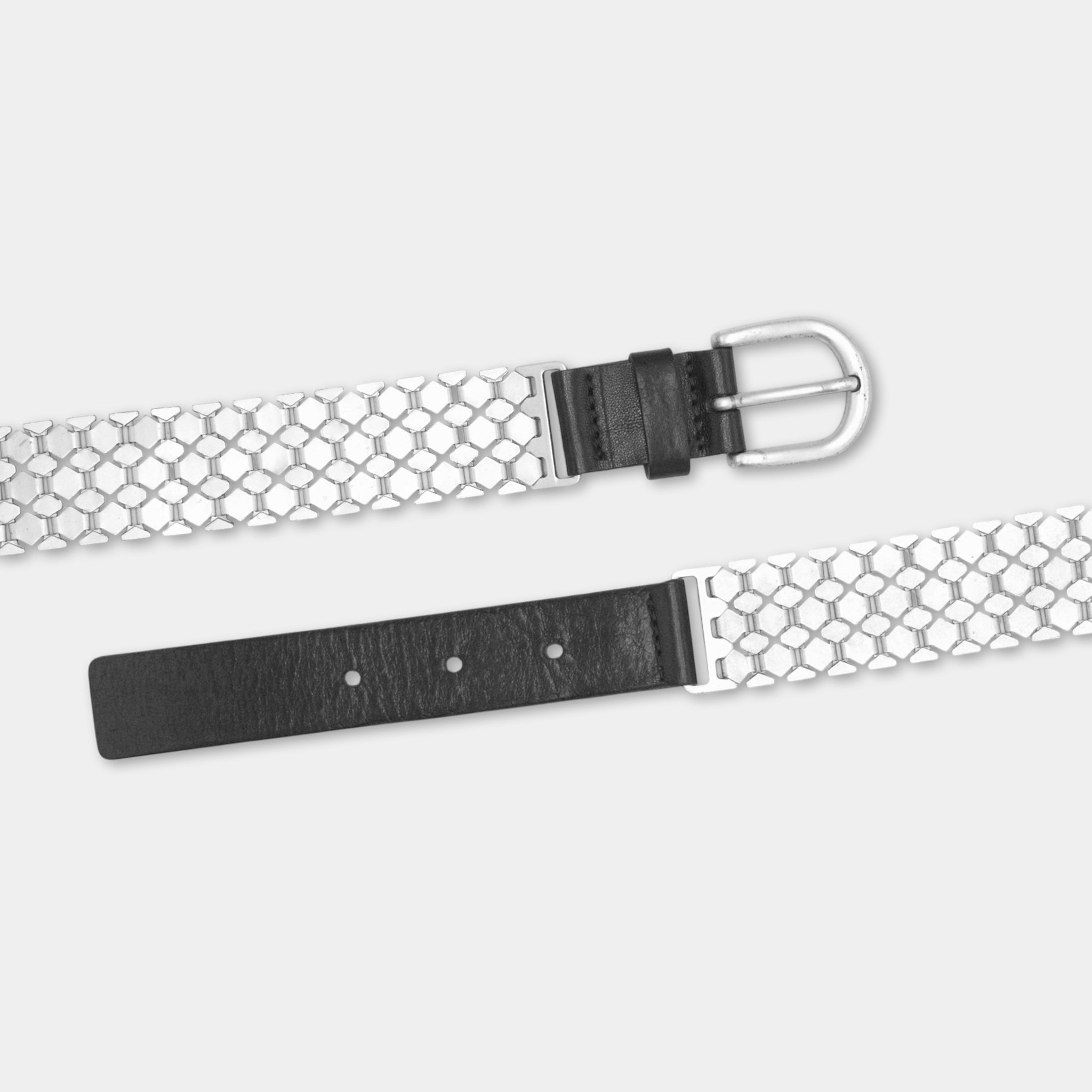 A black and silver metal belt with a round buckle, displayed against a white background.