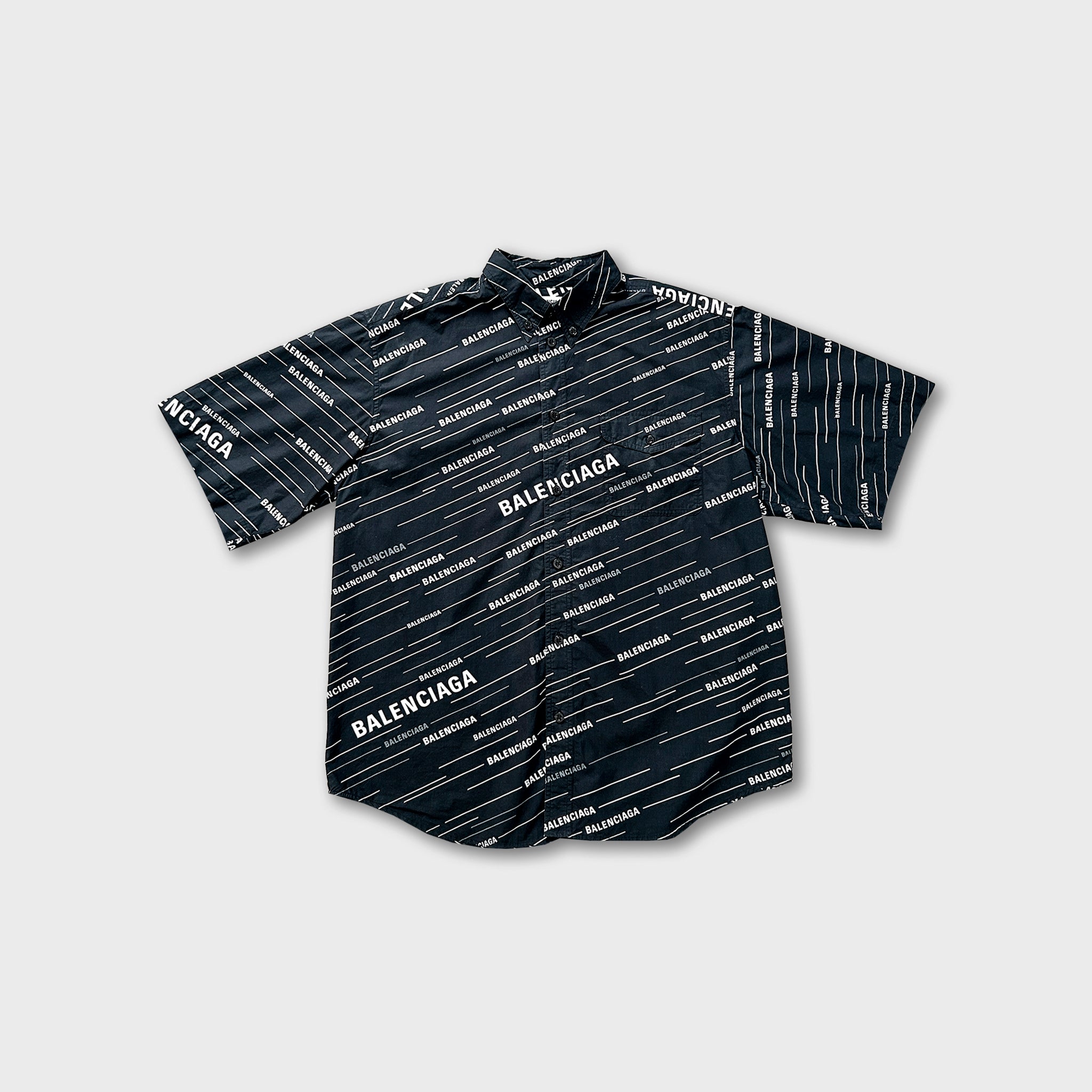 A black and white patterned shirt with the word "BALENCIA" printed on it.