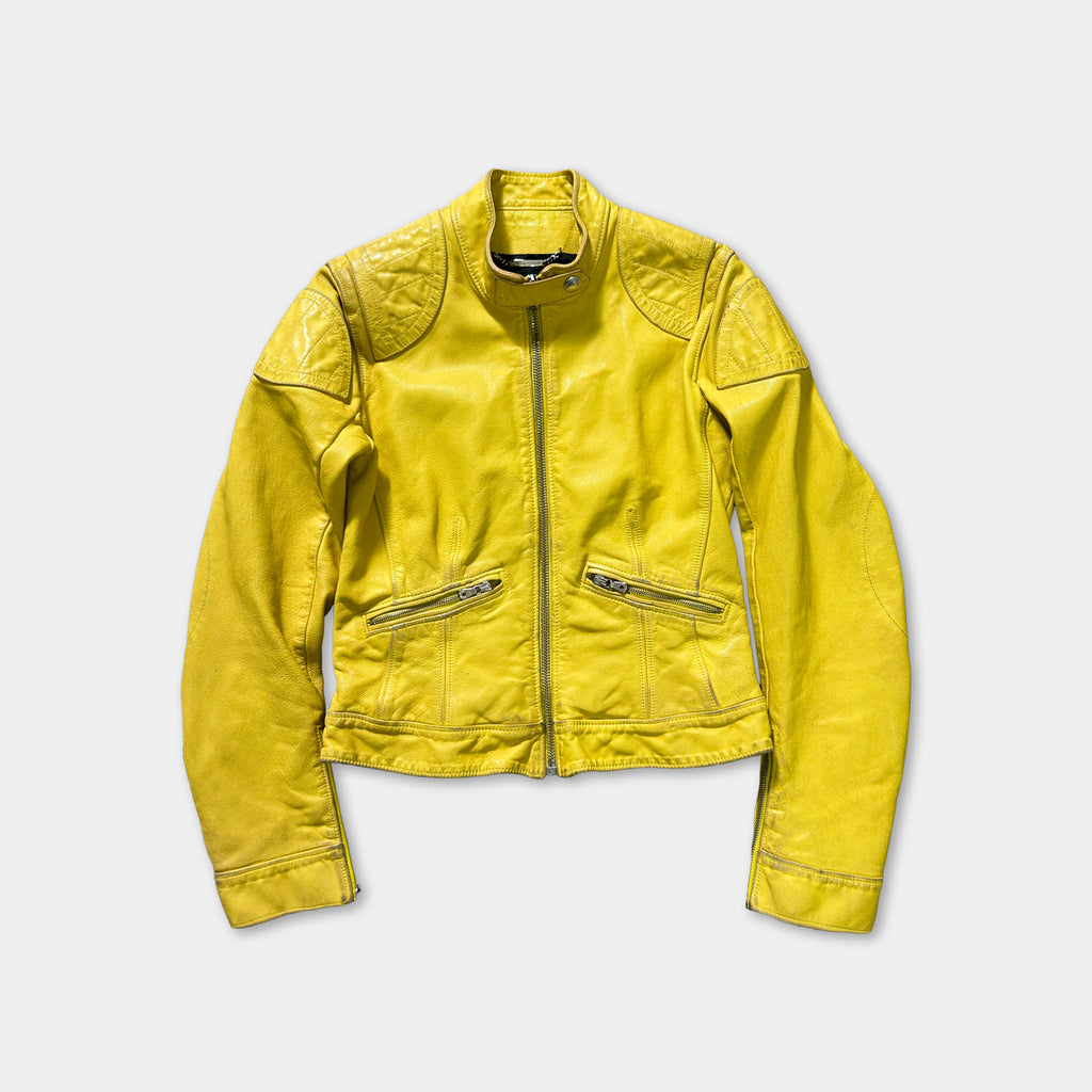 A bright yellow leather jacket with a zipper and two pockets, displayed against a white background.