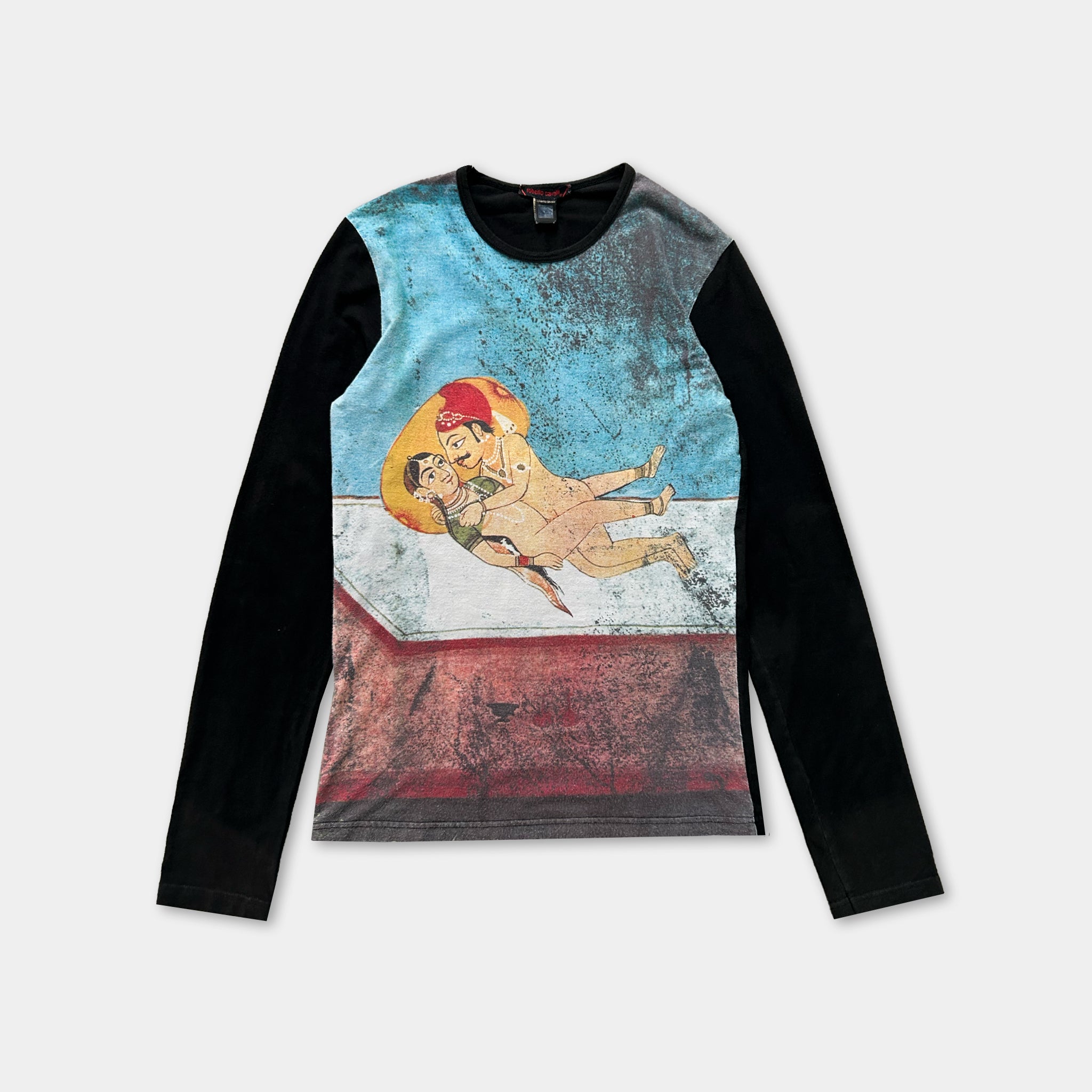 The image is a long-sleeved shirt with a colorful graphic design on the front. The design features a man and a woman, with the man appearing to be in a relaxed pose and the woman looking up at him. The shirt has a black and blue color scheme, and the design is printed on the front.