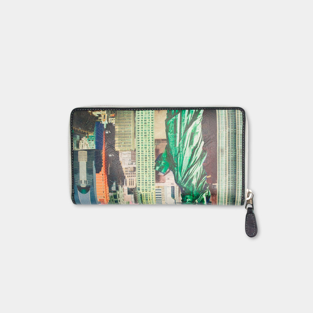 A wallet or card holder with a printed design of a cityscape, including skyscrapers and other urban elements.