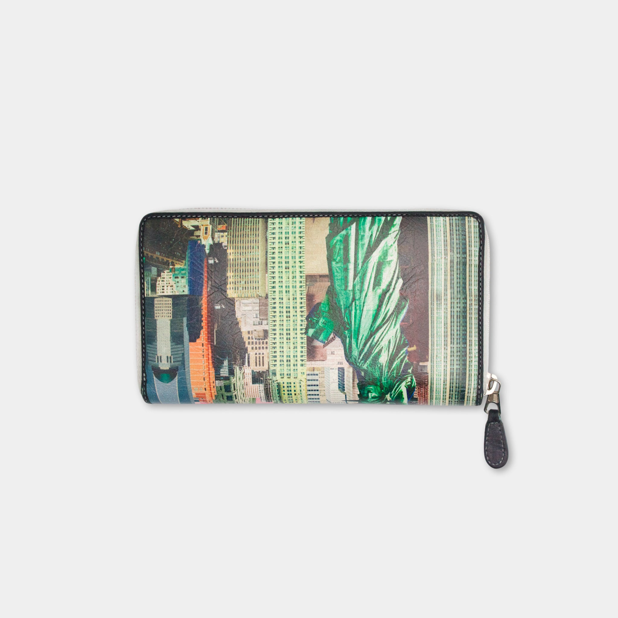A wallet or card holder with a printed design of a cityscape, including skyscrapers and other urban elements.