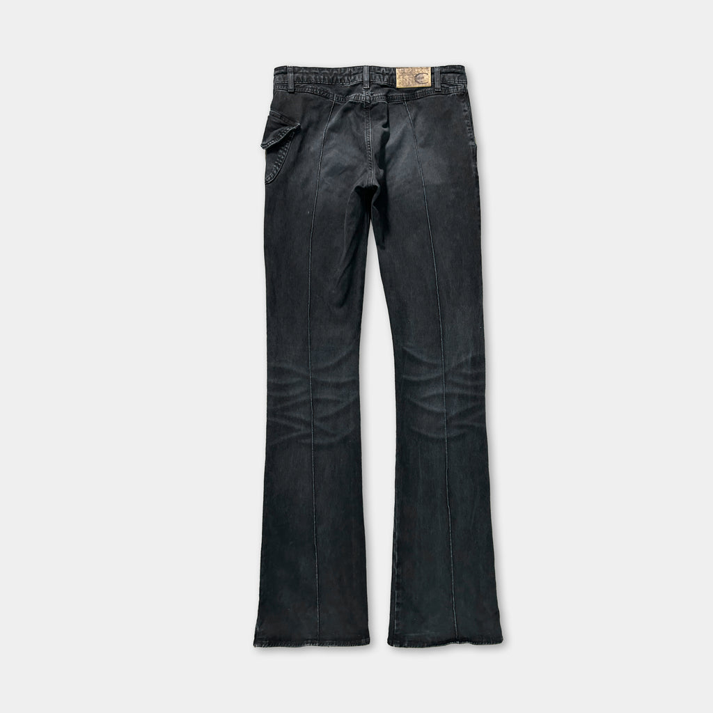 A pair of black jeans with a label on the waistband.