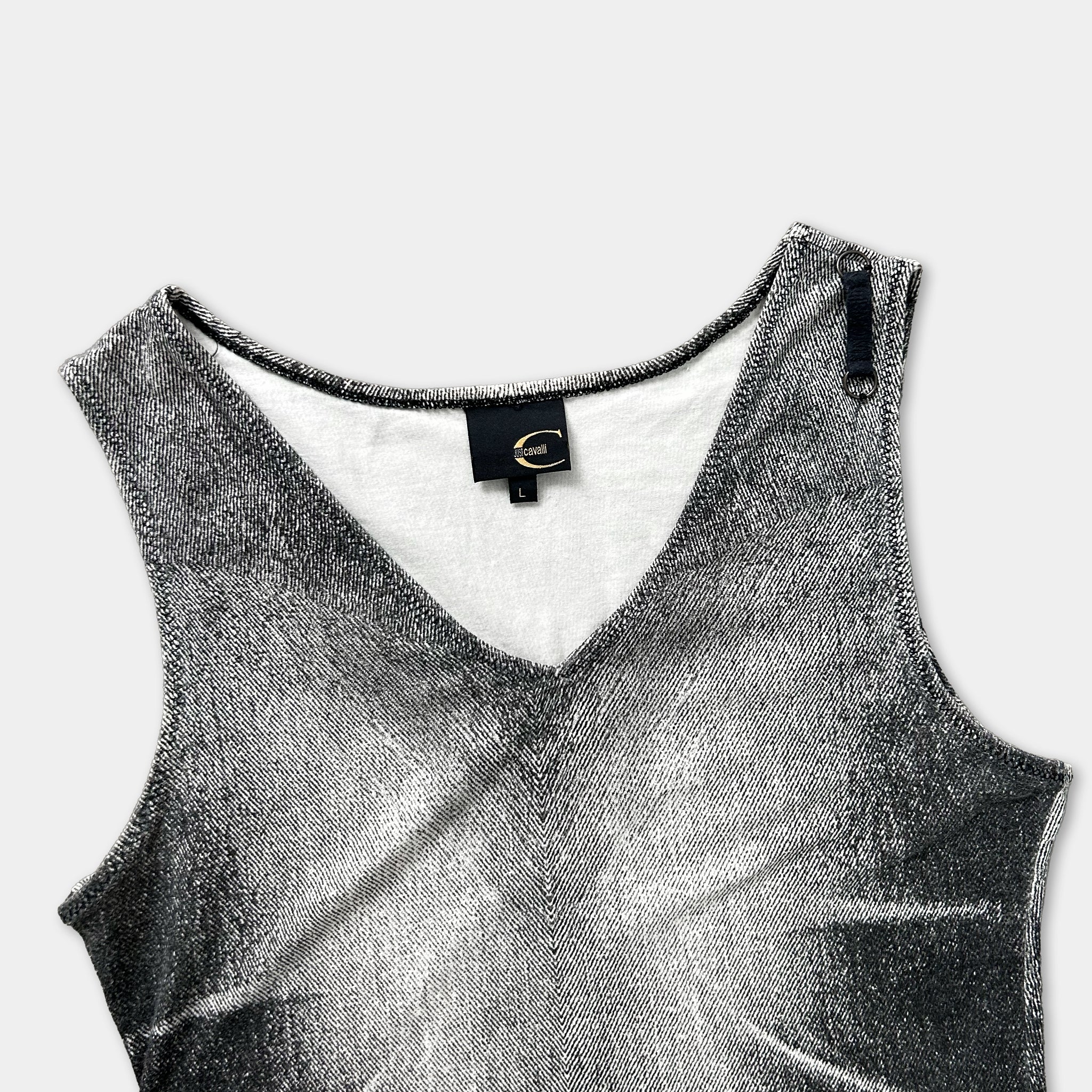 A black and white image of a sleeveless top with a v-neck and a zipper detail.