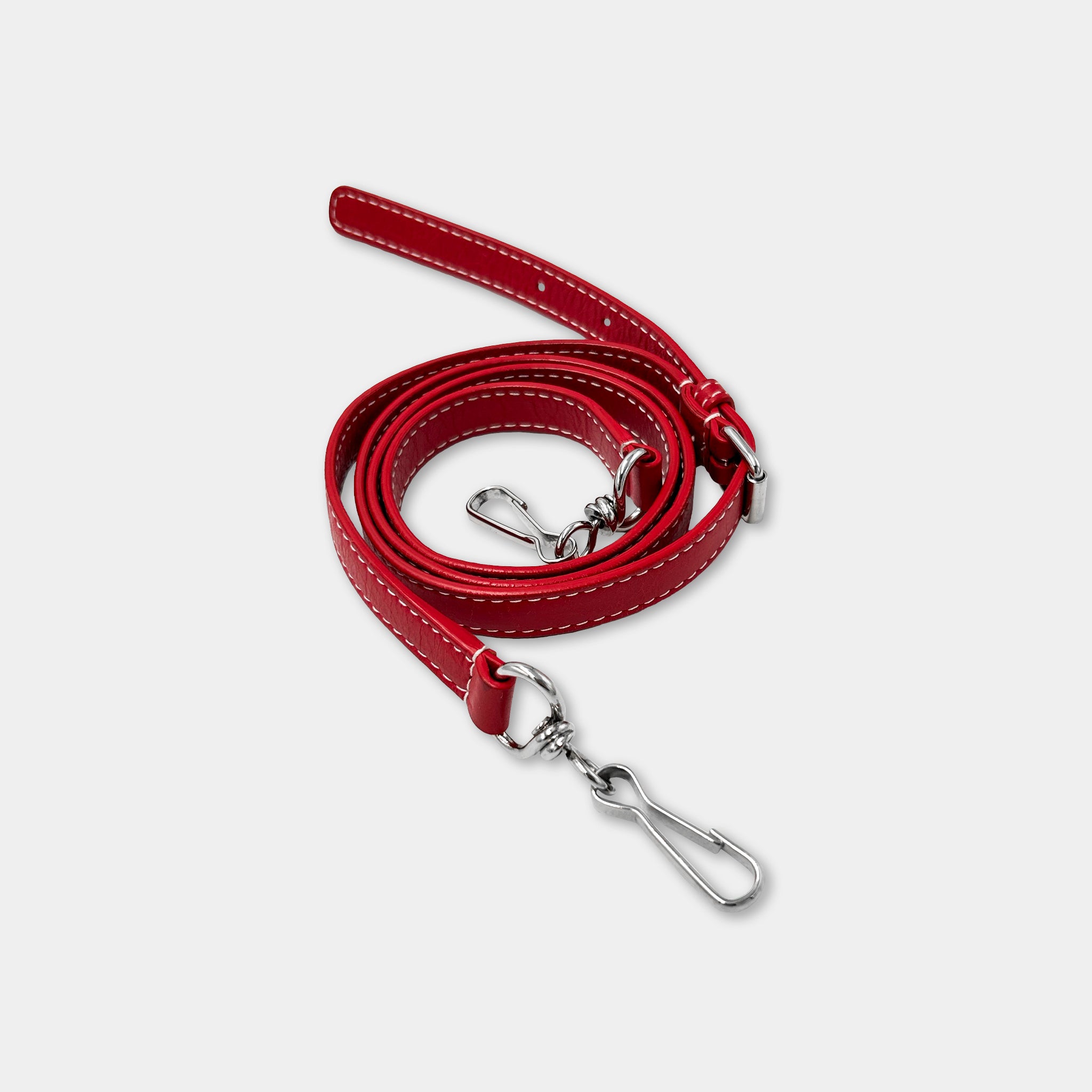 A red leather strap with a metal hook attached to it.