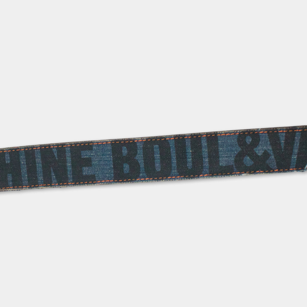 A black and blue belt with the text "SHINE ROUL & V" printed on it.