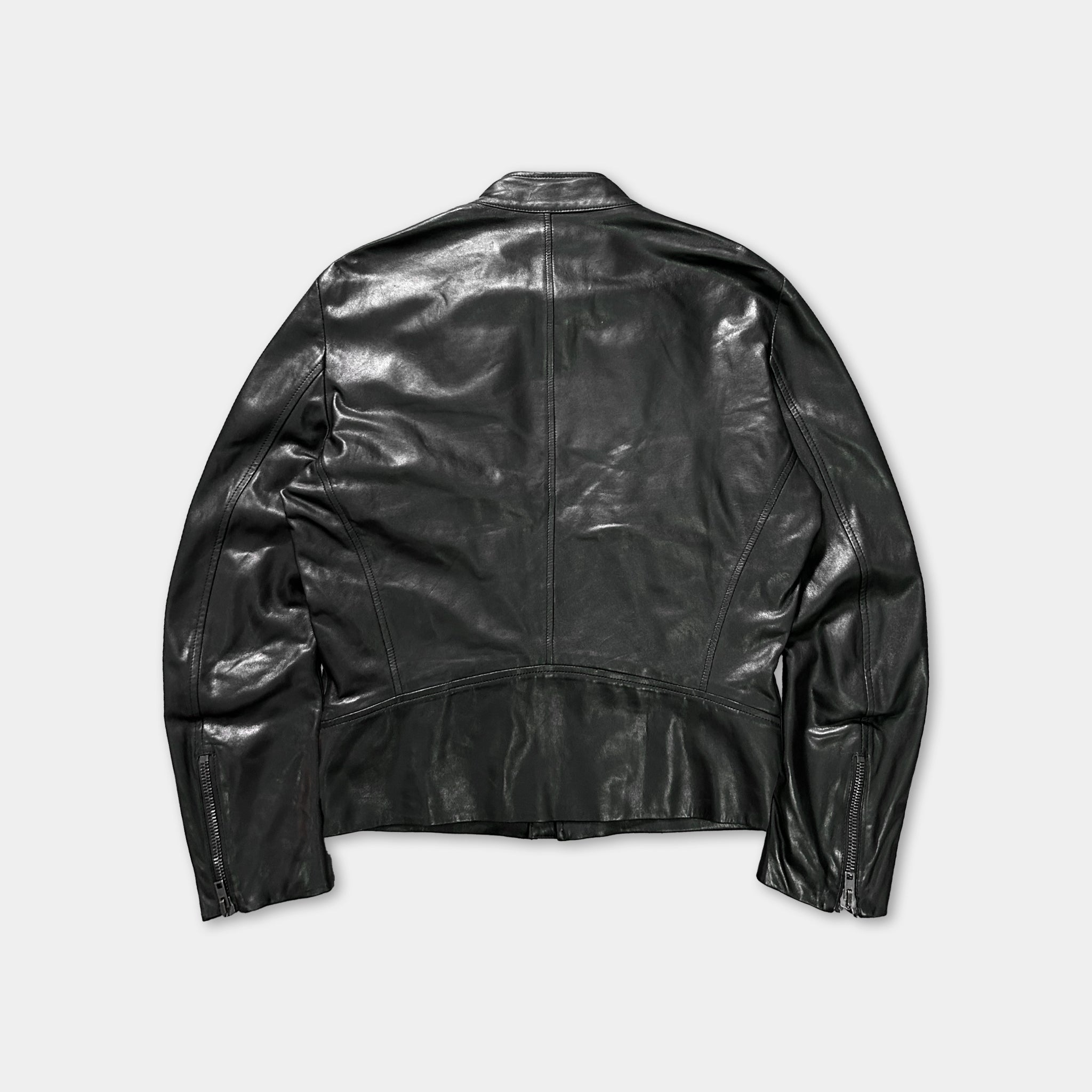 A black leather jacket is shown against a white background.