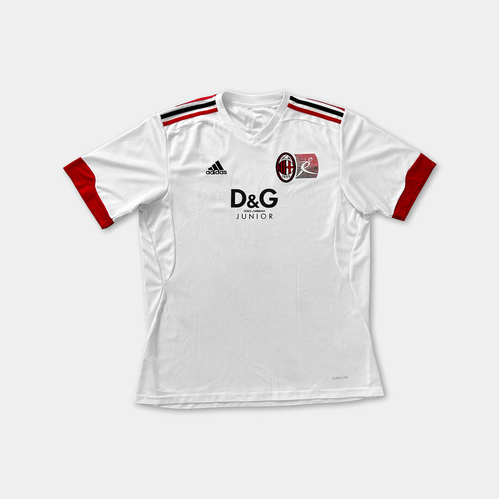 A white soccer jersey with red accents, featuring the Adidas logo and the Junior logo.