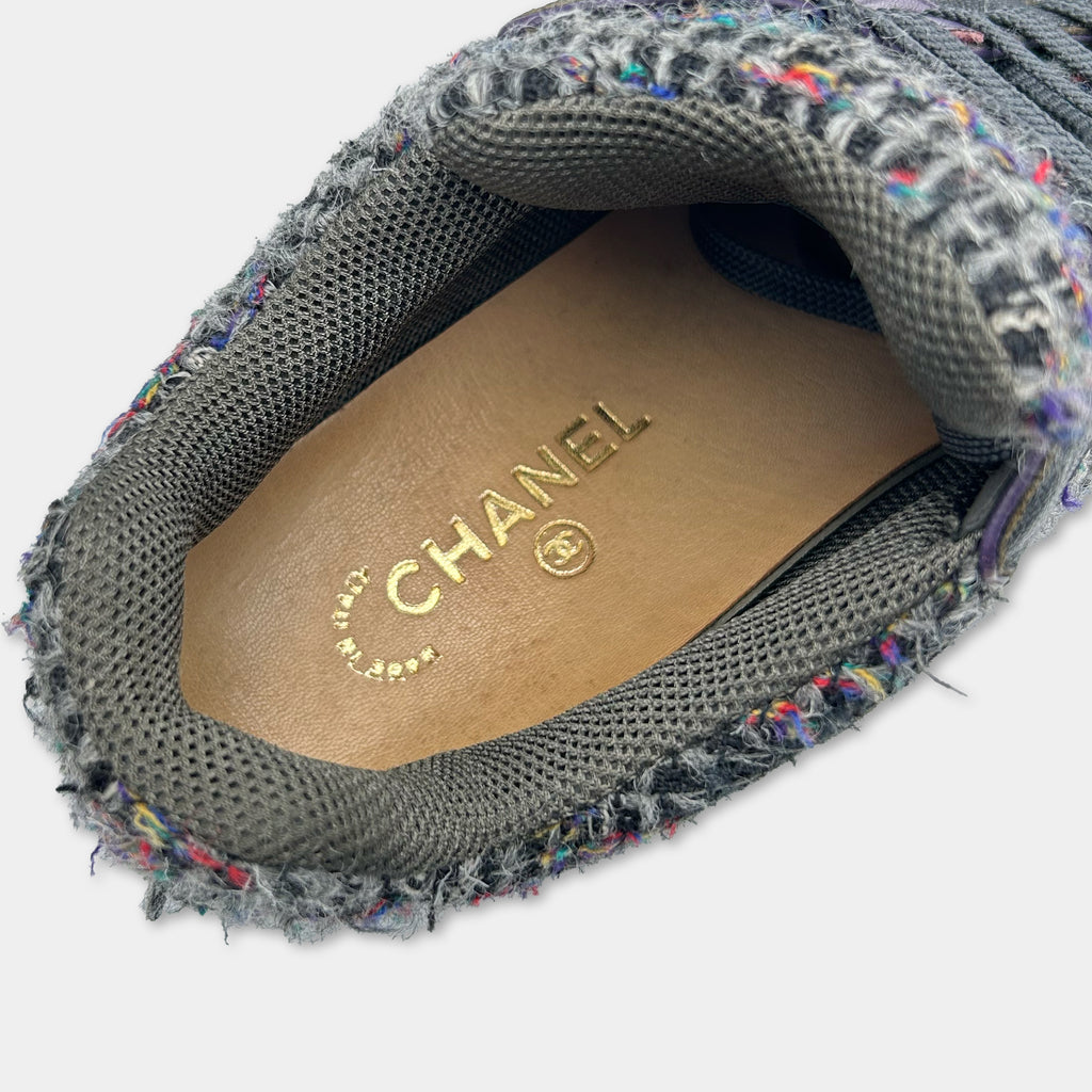 A close-up view of a shoe sole with the Chanel logo printed on it.