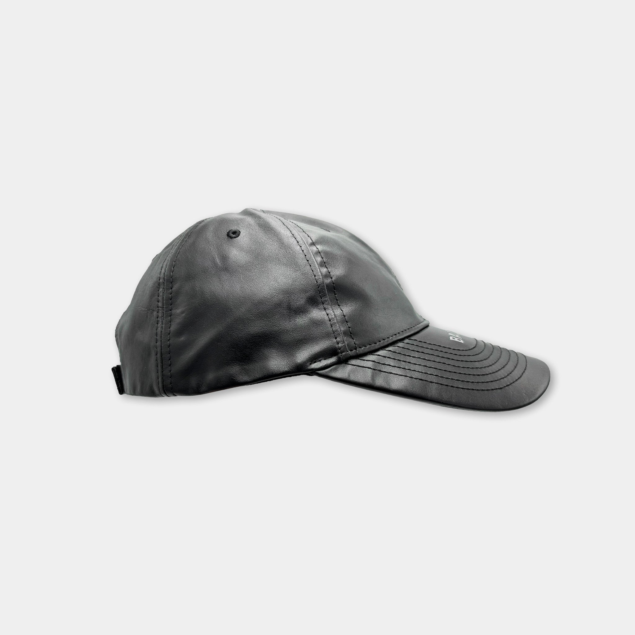 A black baseball cap is shown against a white background.
