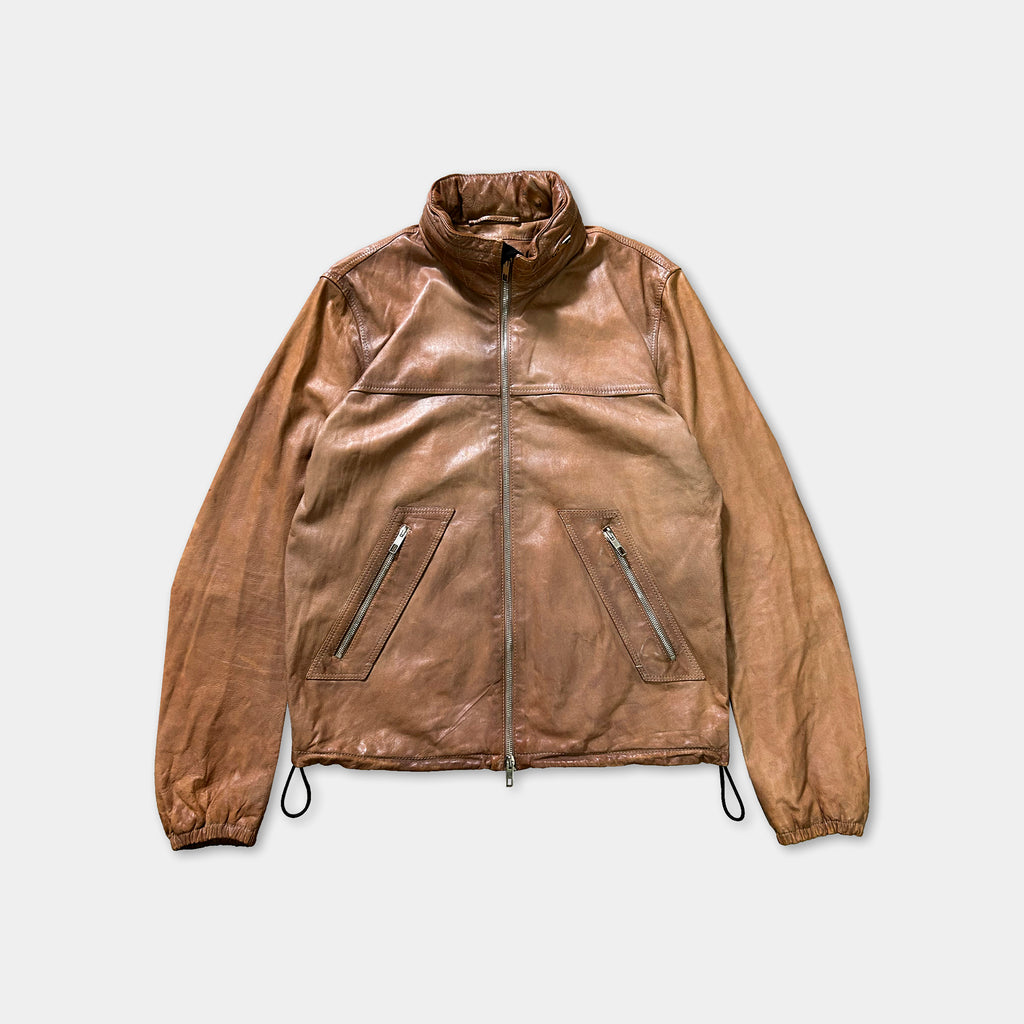 A brown leather jacket with a zipper and two pockets, displayed against a white background.