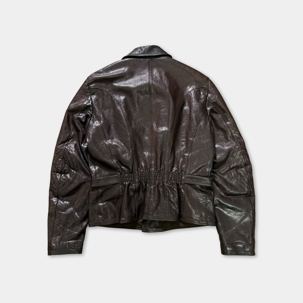 A dark brown leather jacket is shown against a white background.