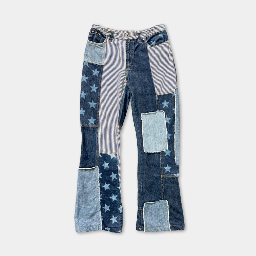 A pair of blue jeans with star and stripe patches, creating a unique and visually interesting design.