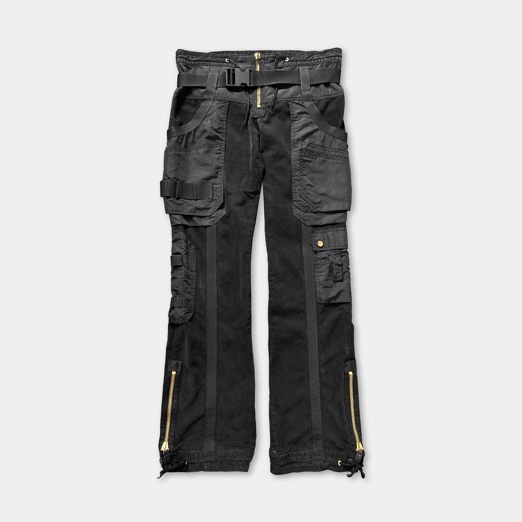 A pair of black cargo pants with multiple pockets and zippers.