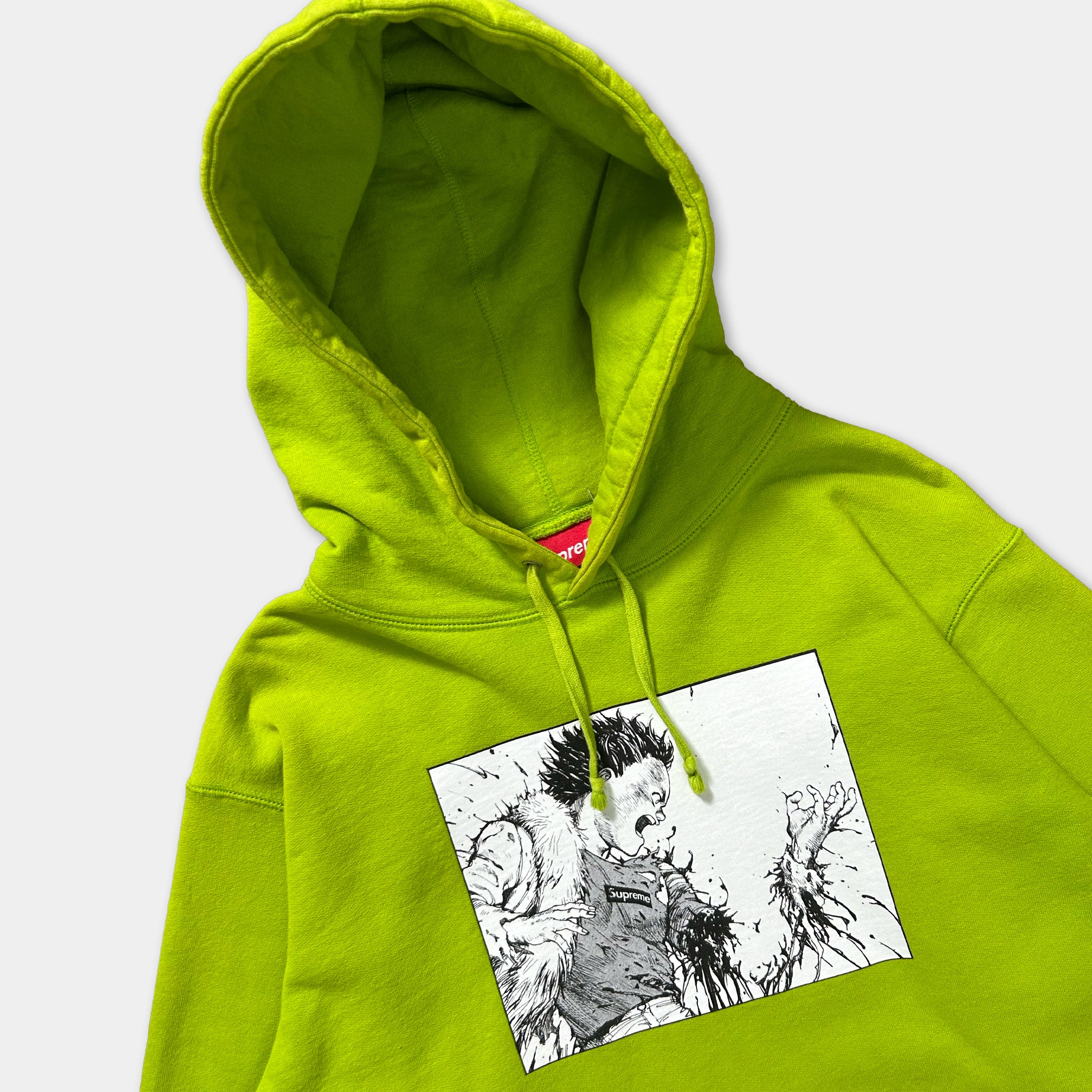 A bright green hoodie with a graphic design on the front.