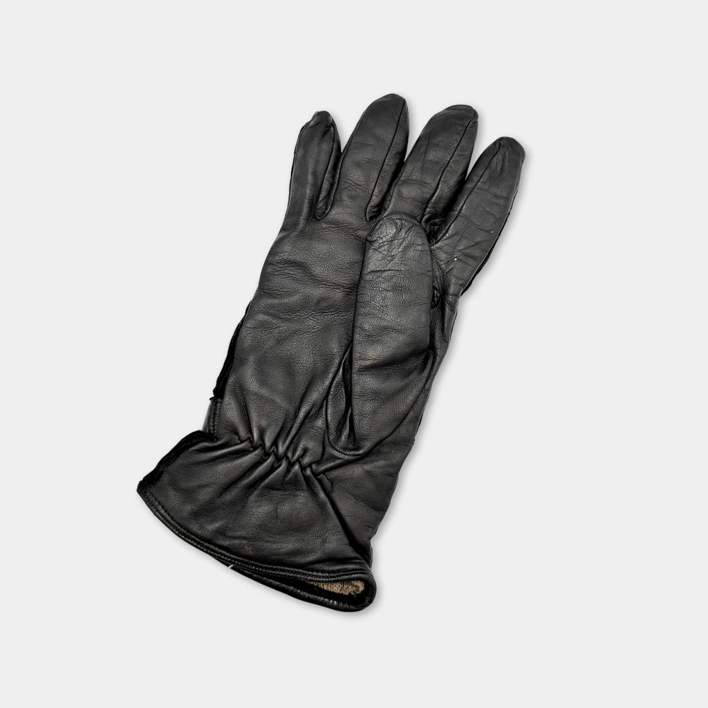A pair of black leather gloves is shown against a white background.