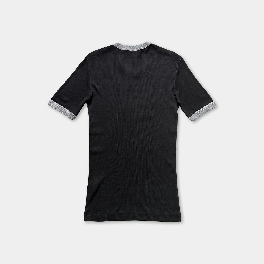 a black short-sleeved shirt with grey trim around the sleeves.