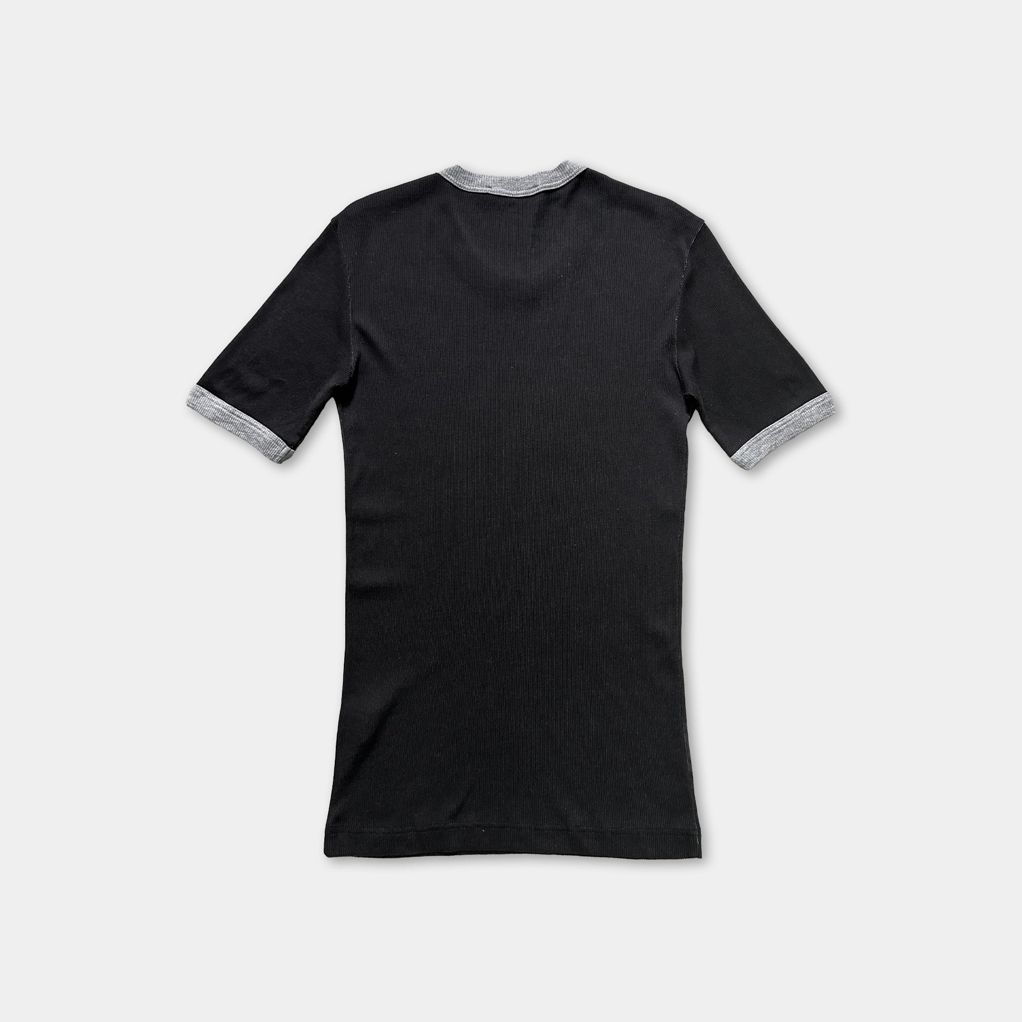 a black short-sleeved shirt with grey trim around the sleeves.