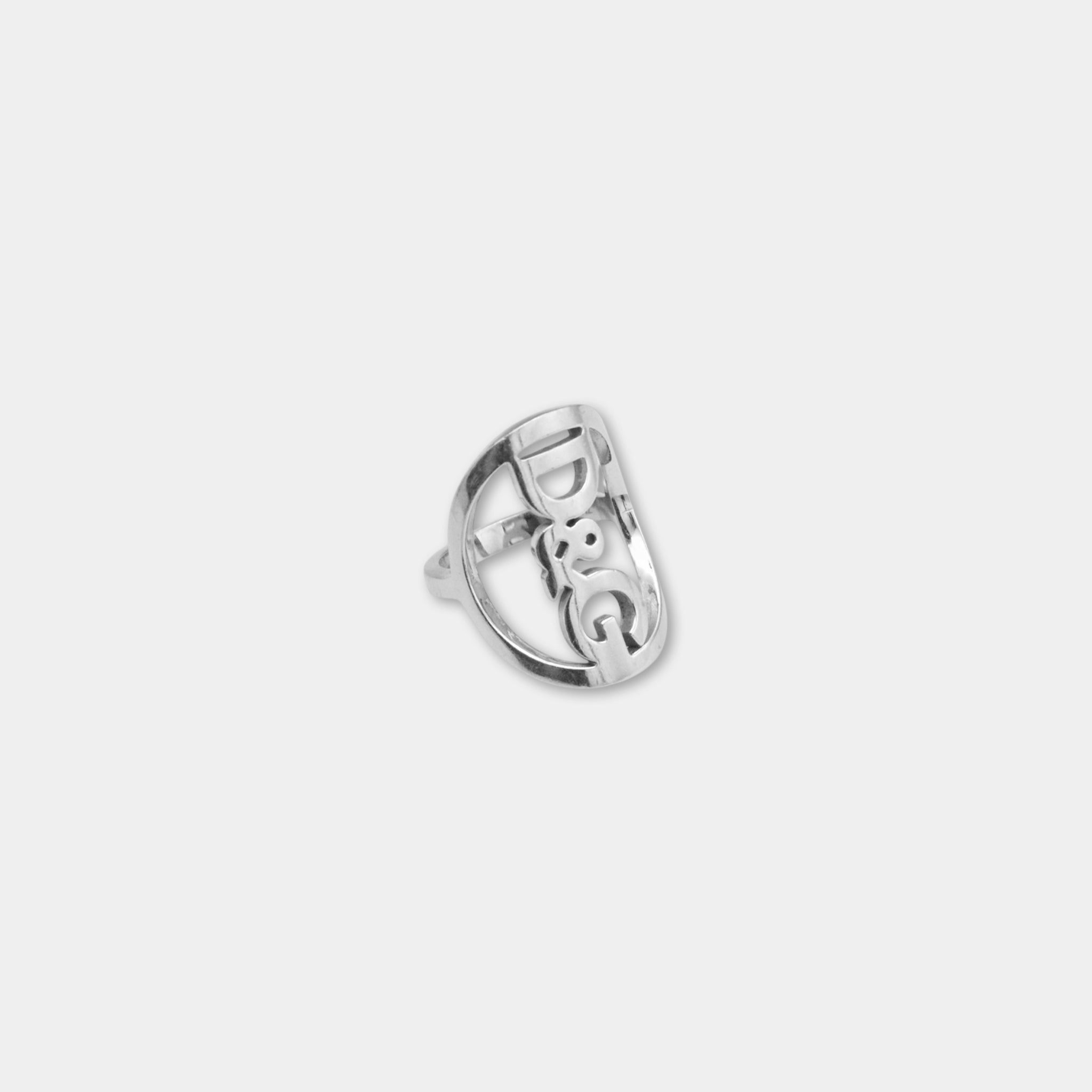 A silver ring with the letters "DG" prominently displayed in the center.