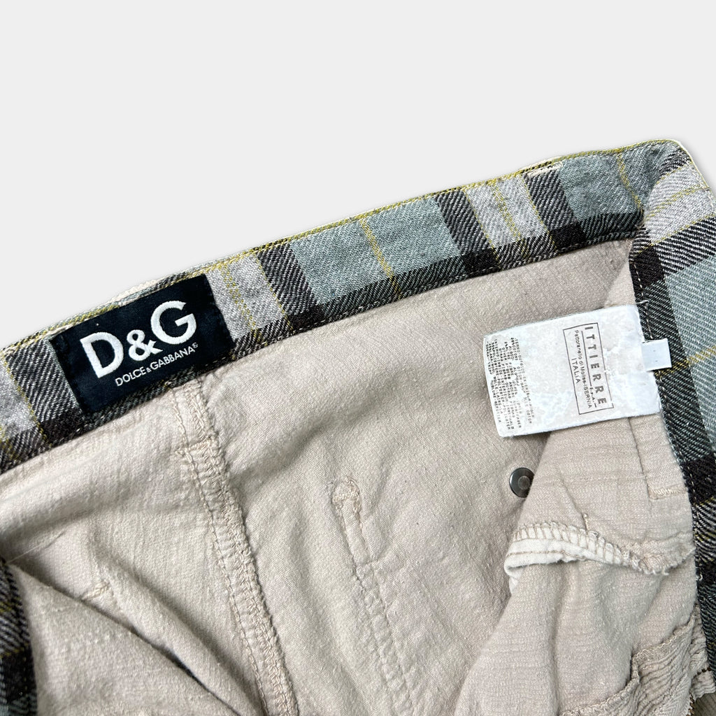 A pair of plaid jeans with a D&G brand label visible.