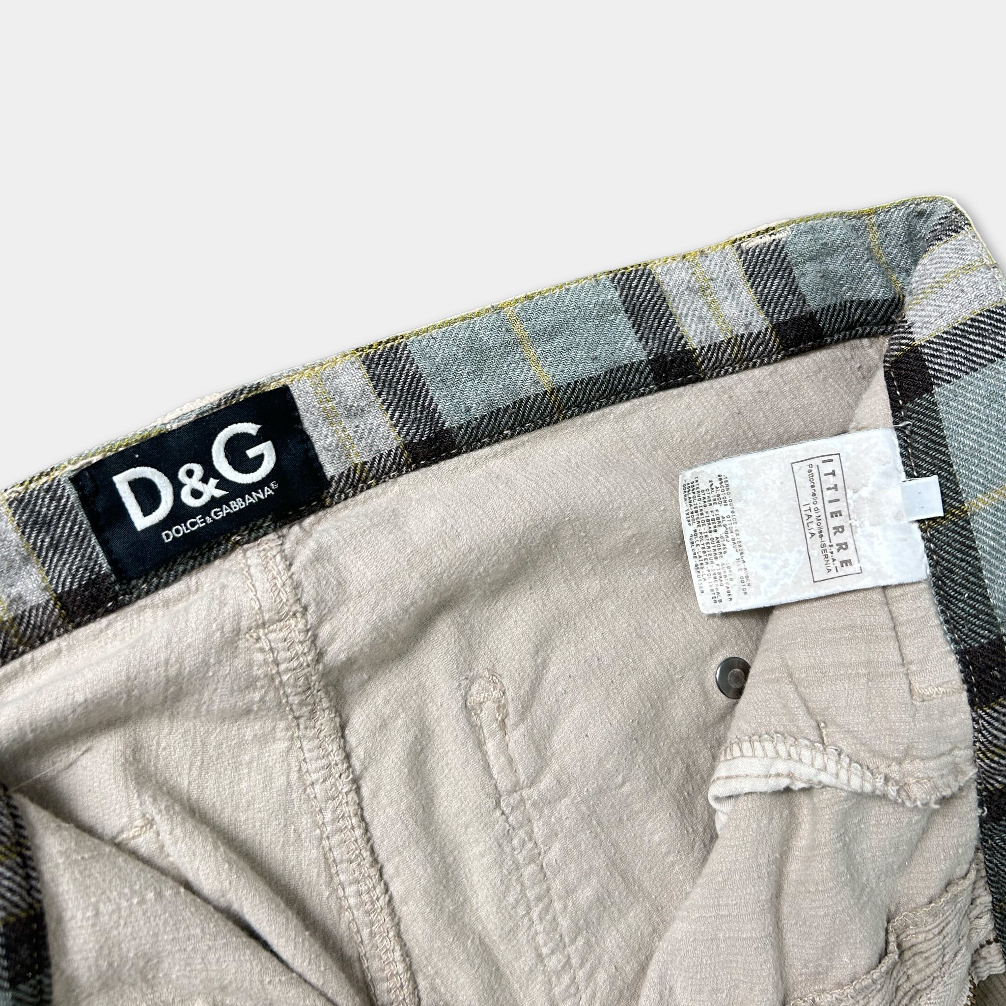 A pair of plaid jeans with a D&G brand label visible.