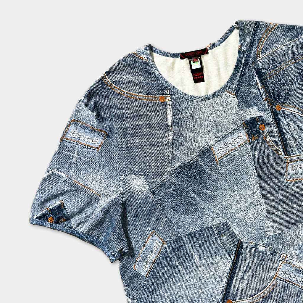 a t-shirt with a denim-inspired design, including various shades of blue denim fabric and pockets.