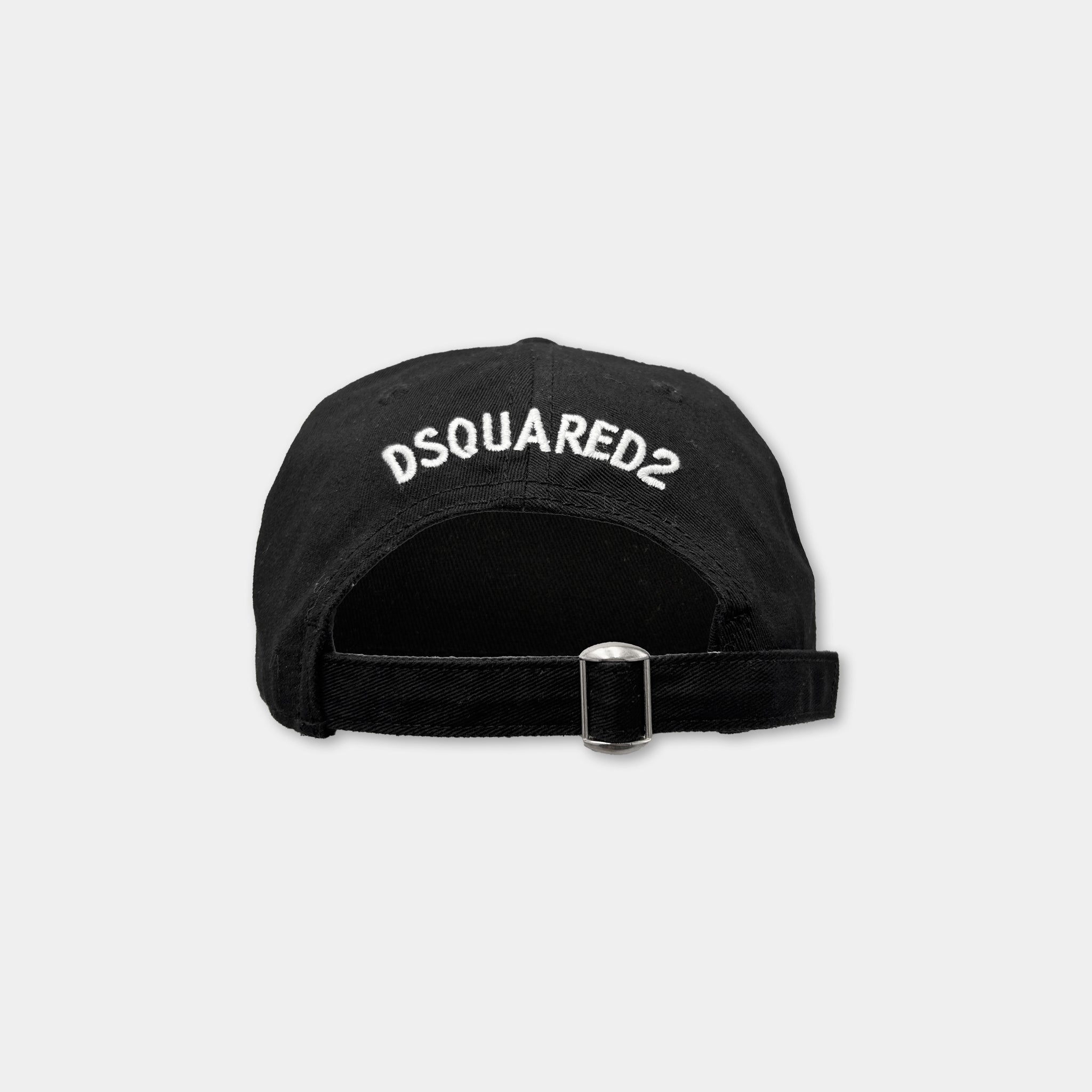A black baseball cap with the logo "DSQUARED2" printed on it.