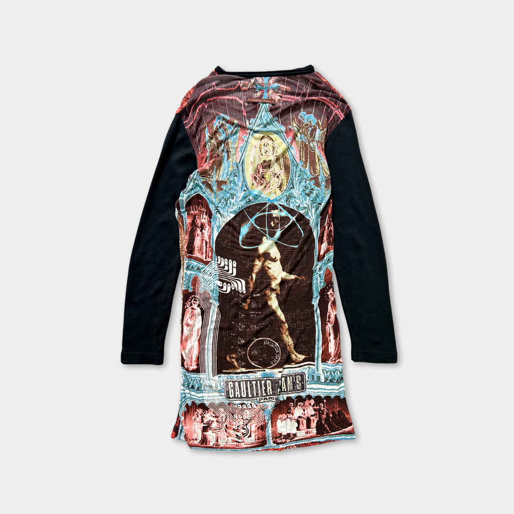 The image is a colorful, patterned long-sleeve shirt with a variety of images and designs on the front.