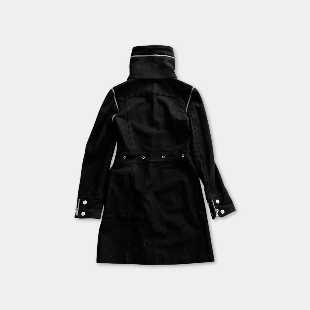 A black coat with a high collar and zipper details is shown against a white background.