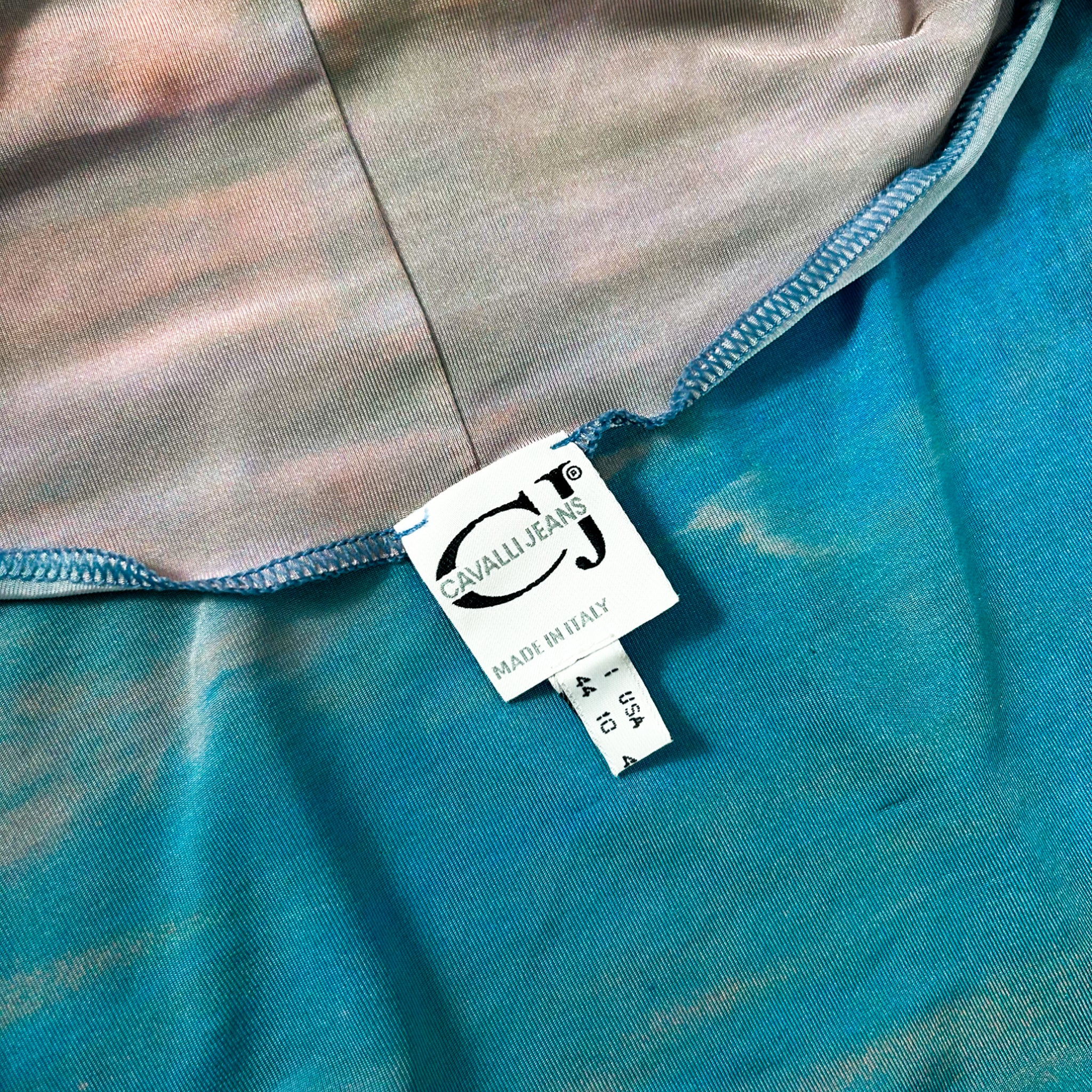 a close-up view of a label attached to a piece of clothing, with a blue and white color scheme.