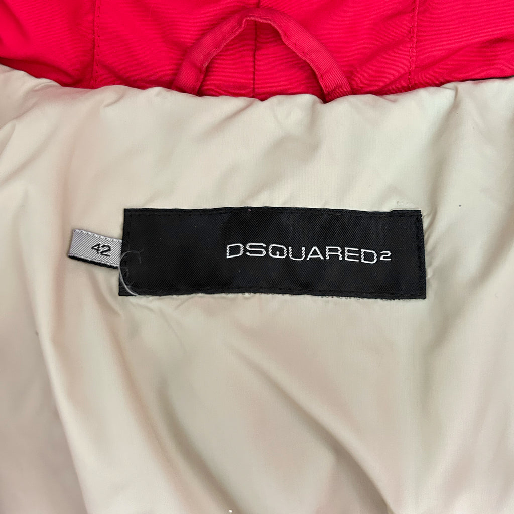 a close-up view of a red and white jacket with a black label on the back, displaying the brand name "DSQUARED".