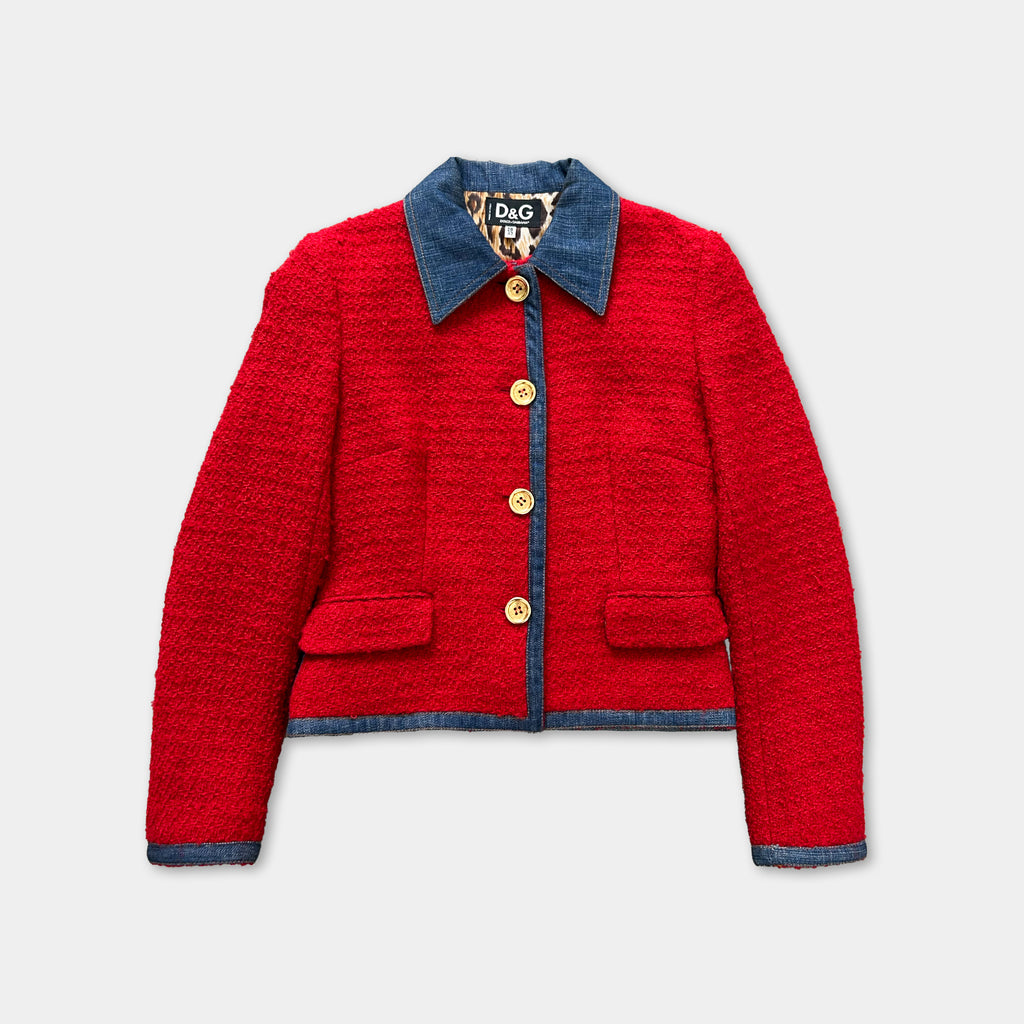 A red tweed jacket with a blue collar and buttons, displayed against a white background.