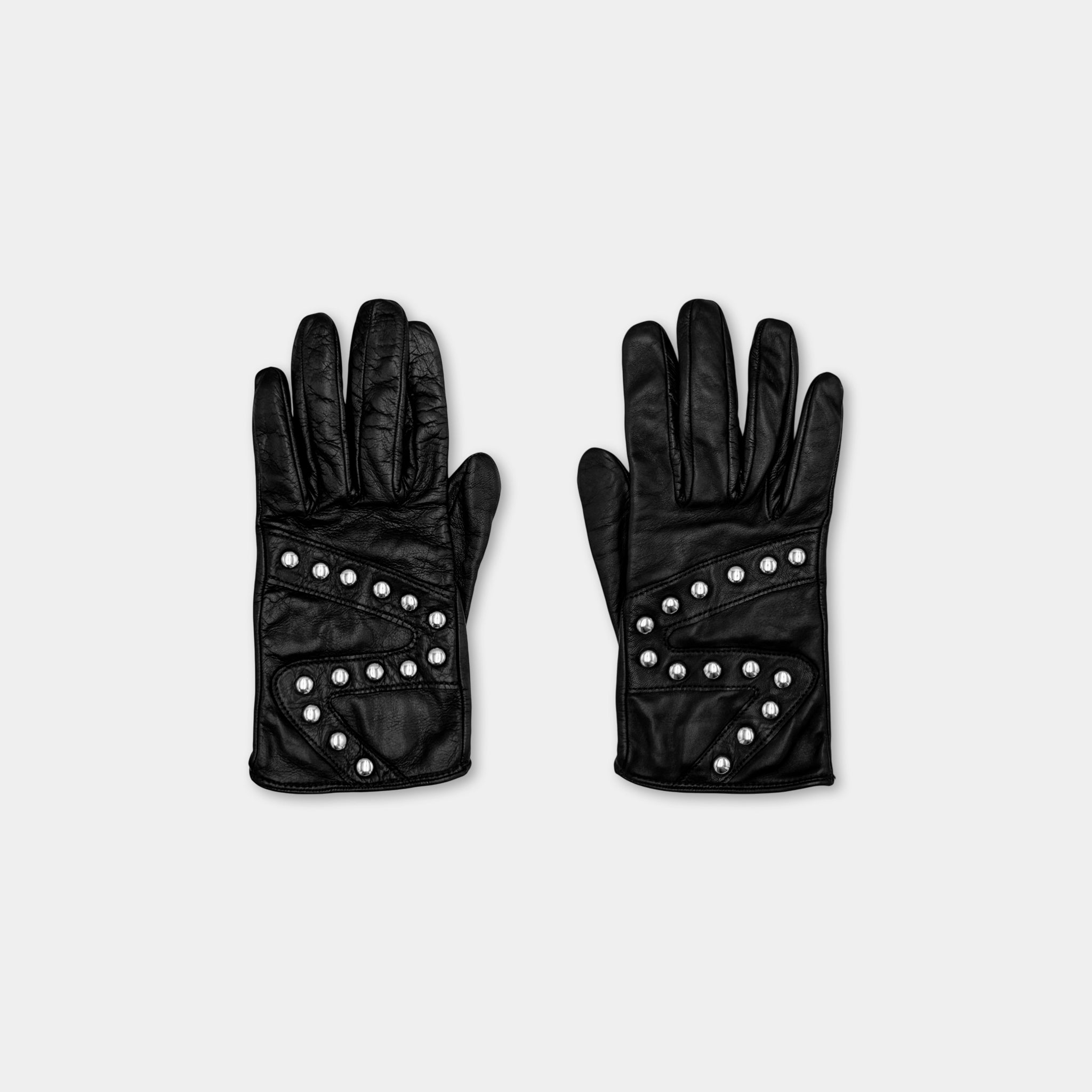 A pair of black leather gloves with silver studs on the palm and fingers.
