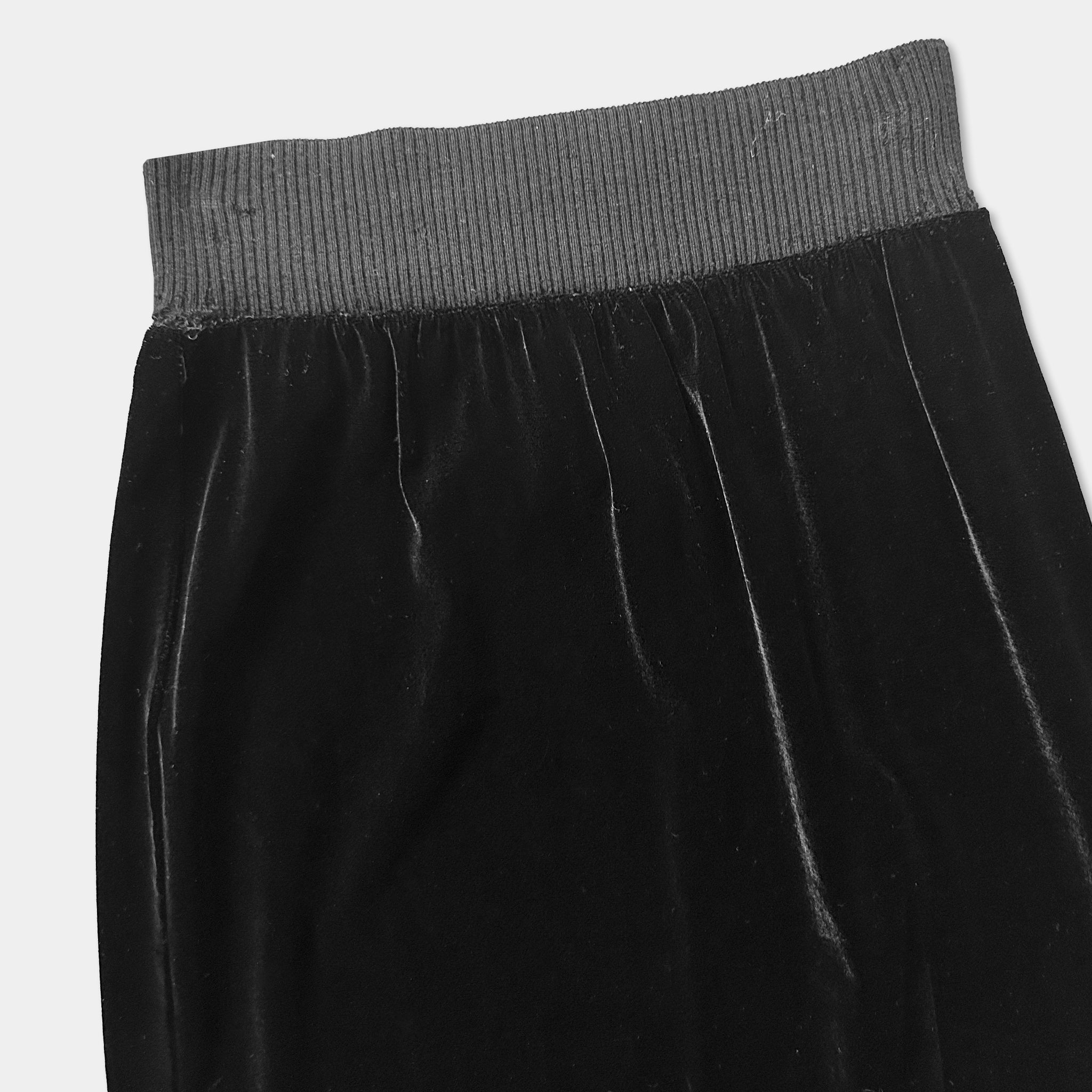 A black velvet skirt with a ribbed waistband.
