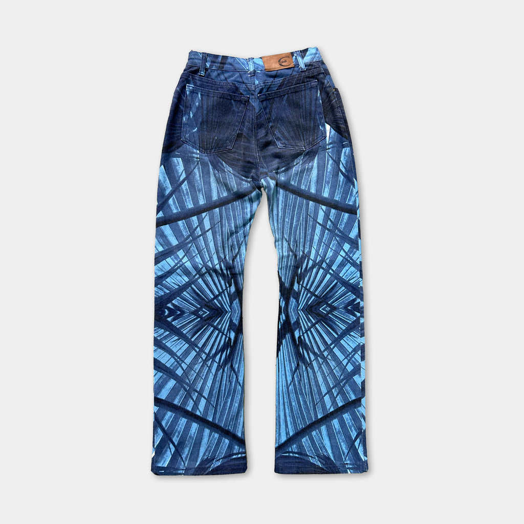 A pair of blue jeans with a unique abstract pattern printed on them.