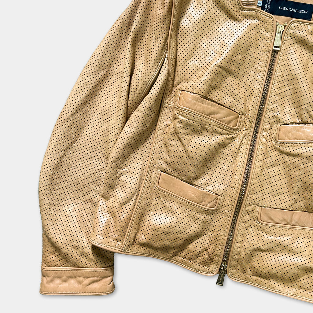 A tan leather jacket with a zipper and two pockets, displayed against a white background.