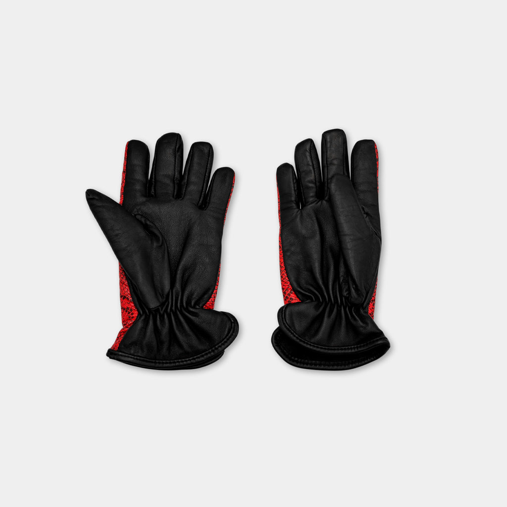 A pair of black leather gloves with red accents, placed side by side against a white background.