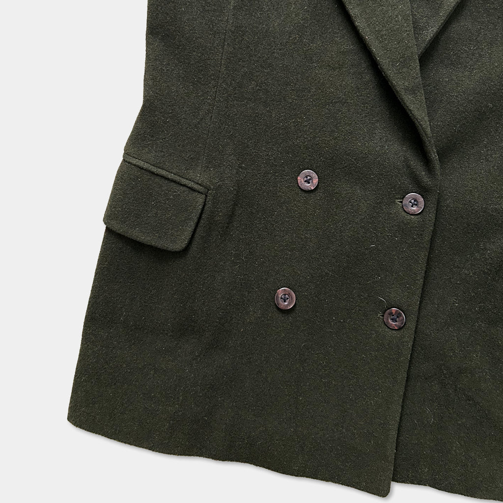 A dark green double-breasted jacket with three buttons and a small pocket on the left side.
