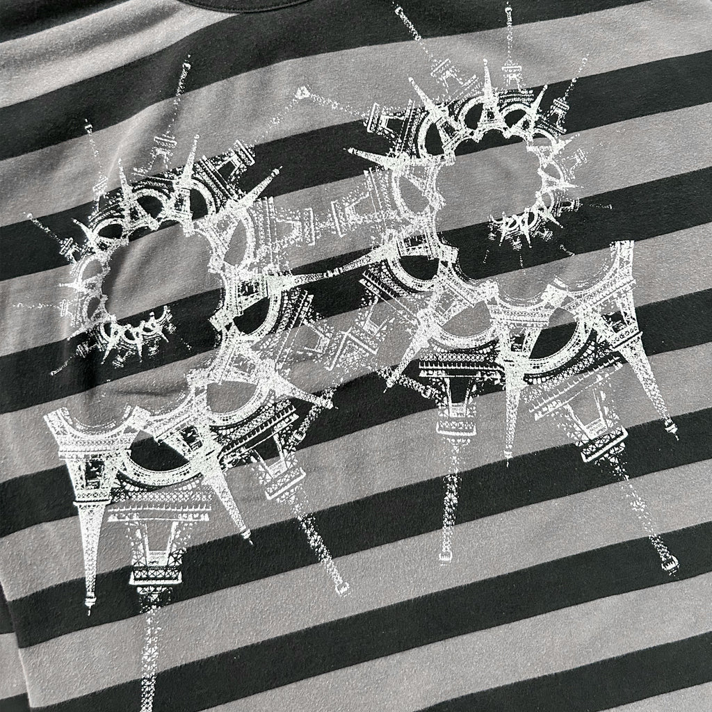 a close-up view of a black and white striped fabric with a unique, intricate design in white.