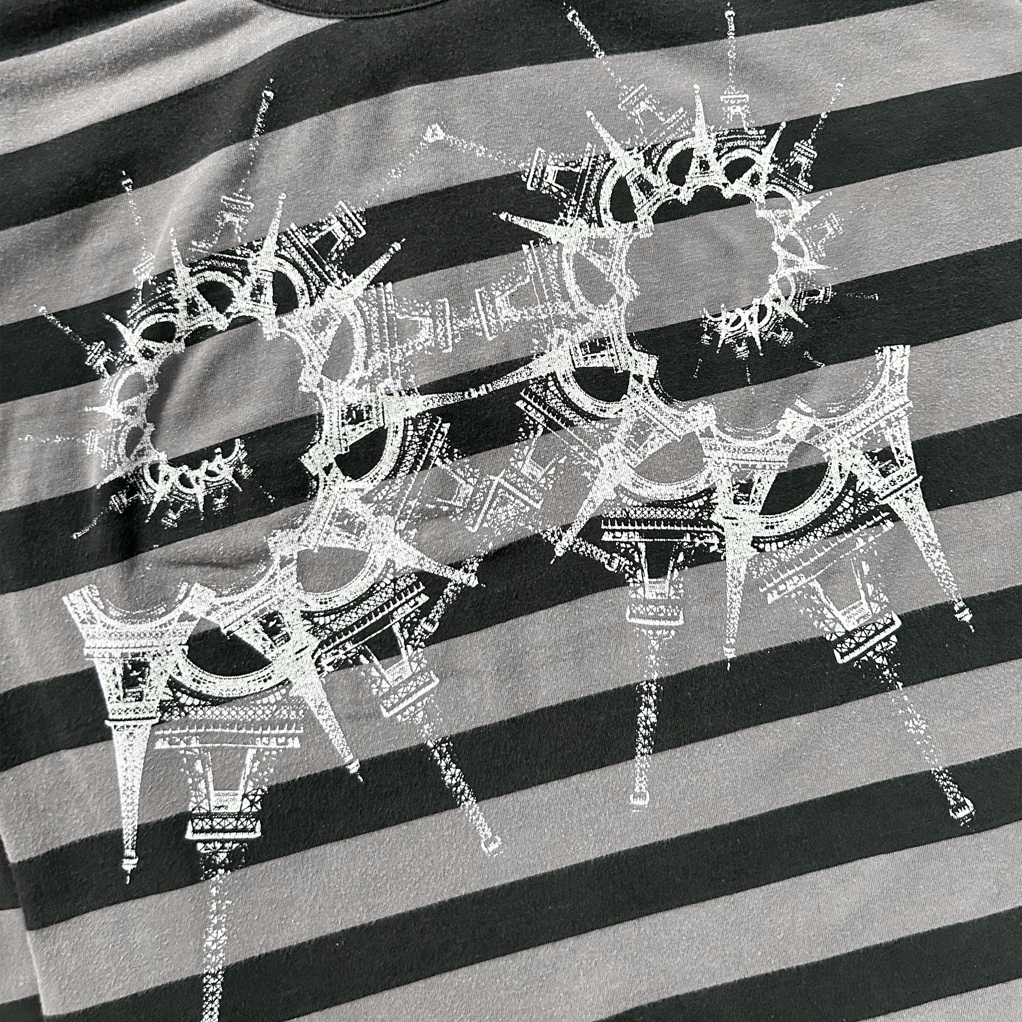 a close-up view of a black and white striped fabric with a unique, intricate design in white.