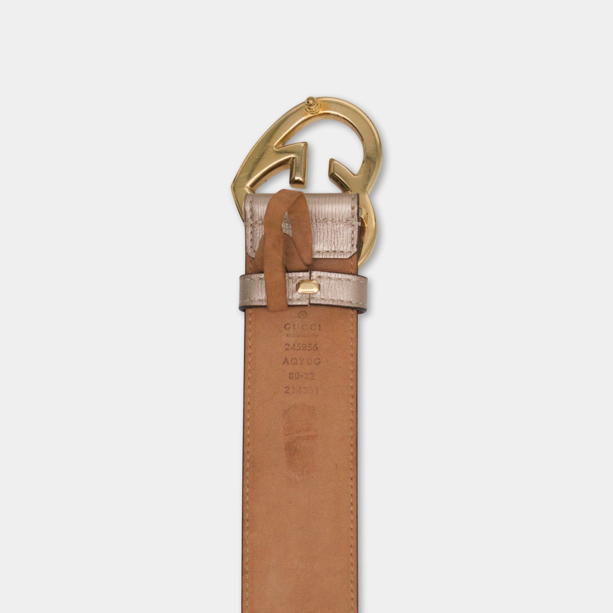 a brown leather belt with a gold buckle, which is a Gucci belt.
