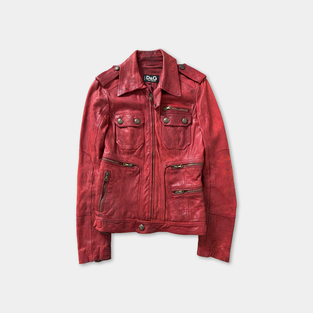 A red leather jacket with multiple pockets and a collar, displayed against a white background.