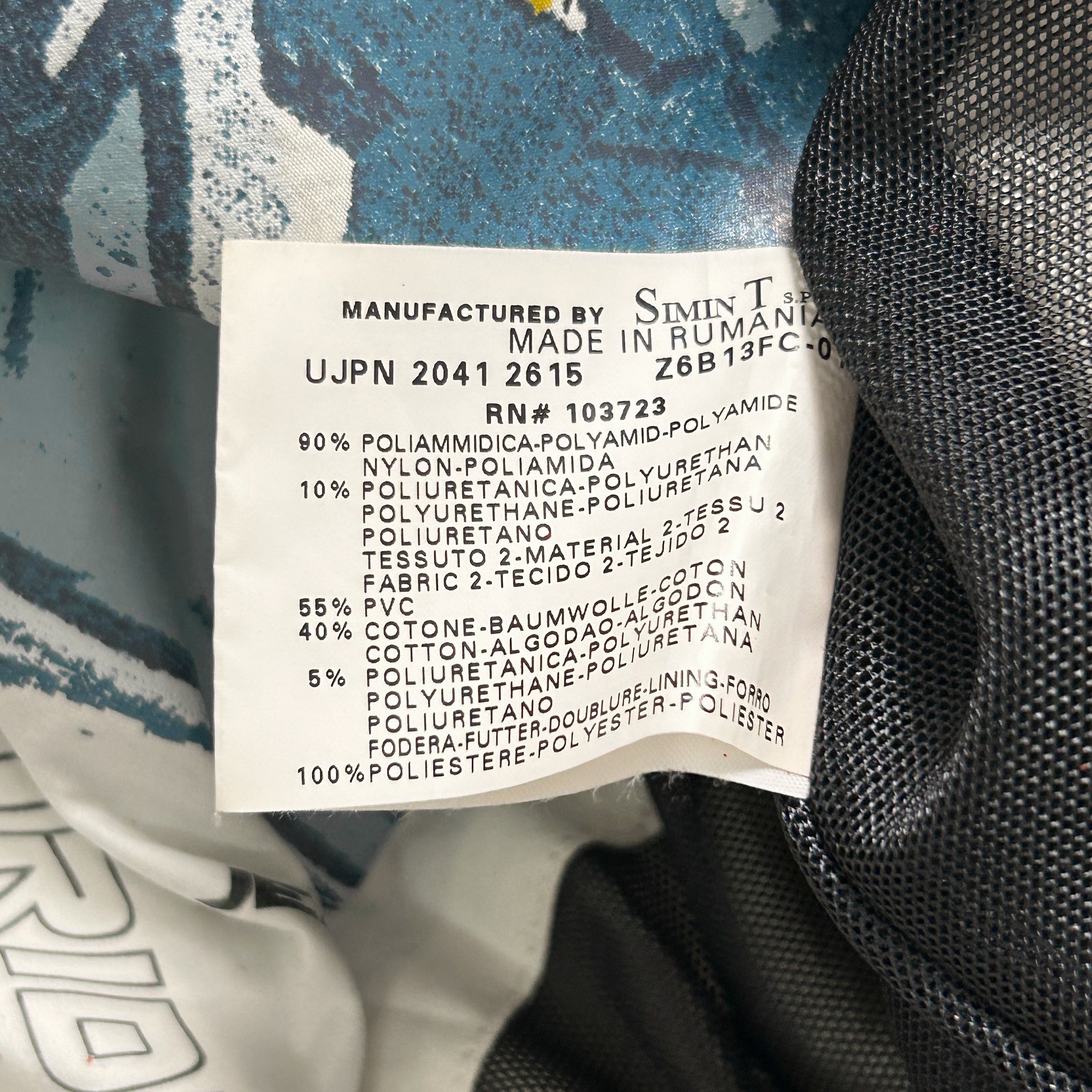 a label with text, likely providing information about the product, such as its manufacturer, material, and specifications.