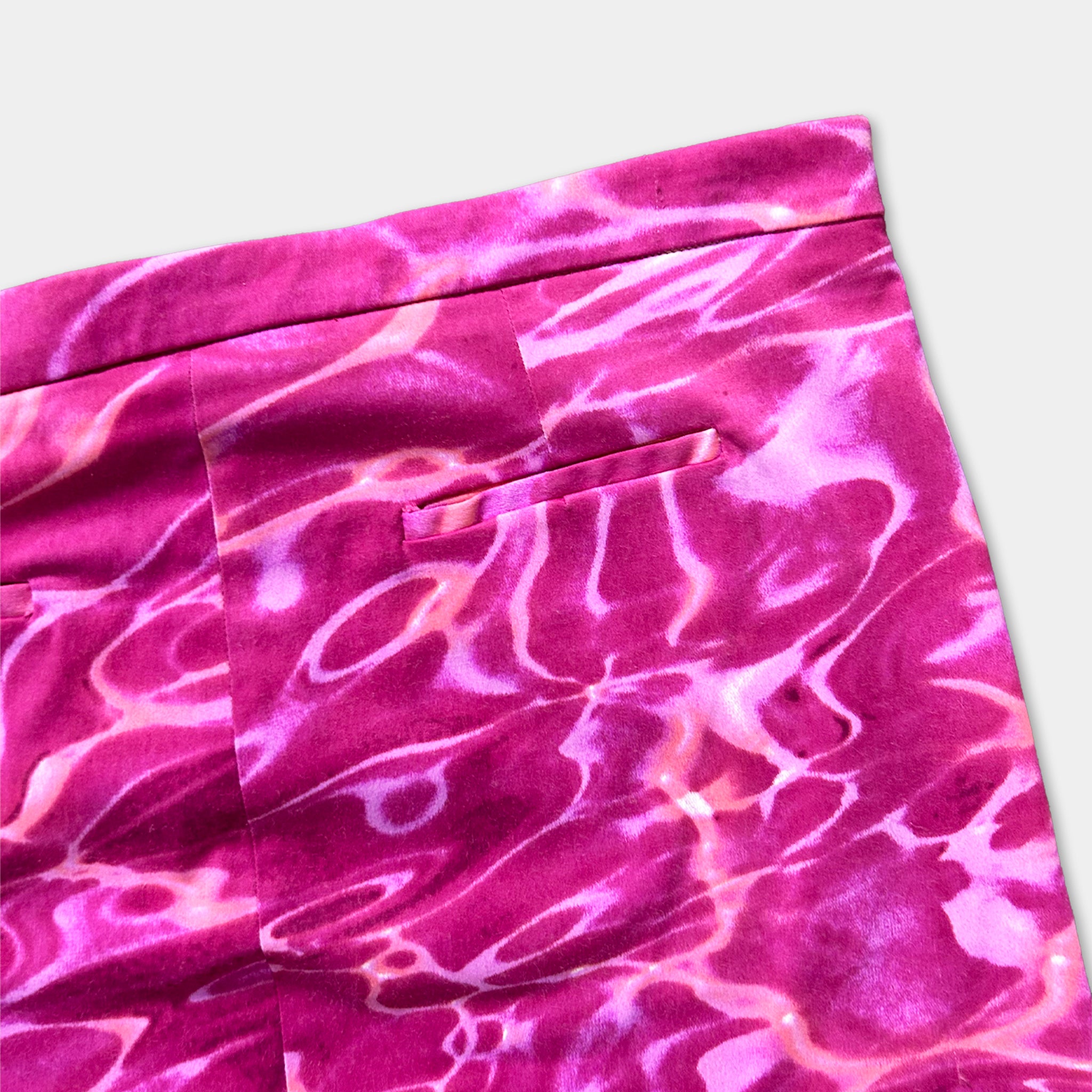 a pair of pink pants with a vibrant, swirling pattern.